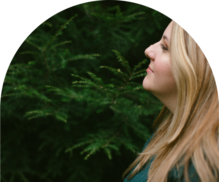 Elizabeth in the woods, staring out into the distance